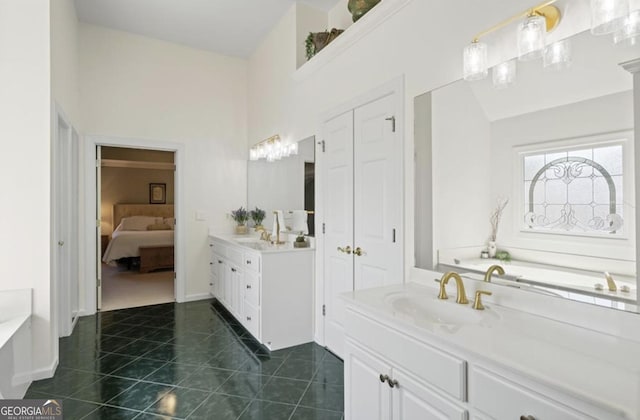 full bathroom featuring tile patterned flooring, two vanities, a garden tub, and a sink