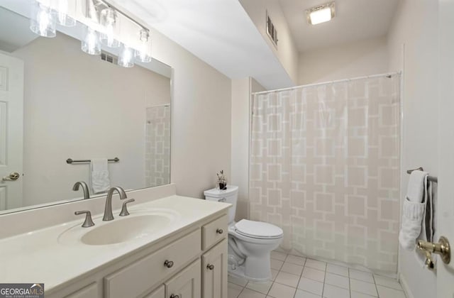 bathroom featuring tile patterned floors, visible vents, toilet, a shower with curtain, and vanity