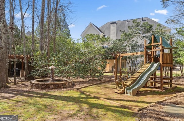 view of jungle gym with a lawn