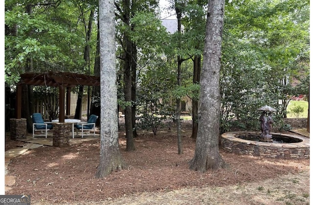 view of yard featuring fence, a patio area, and a pergola