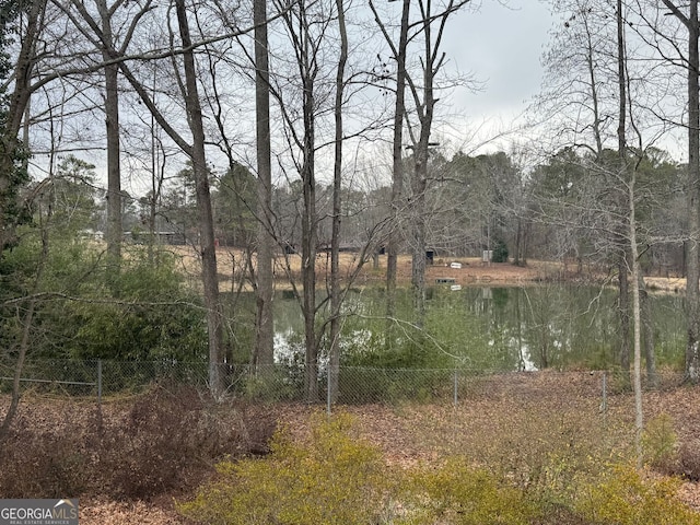 property view of water with fence