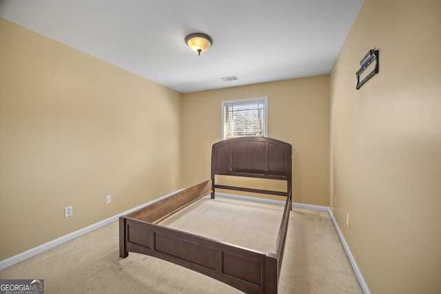 bedroom featuring carpet flooring, visible vents, and baseboards