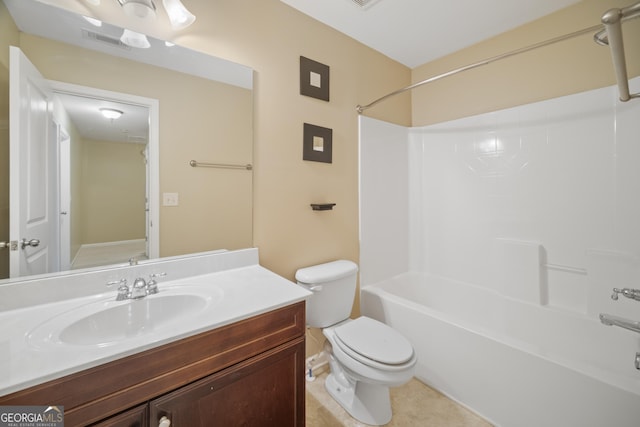 bathroom featuring toilet, vanity, visible vents, tub / shower combination, and tile patterned floors