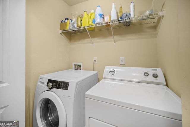 laundry area with laundry area and independent washer and dryer