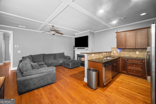 kitchen with a peninsula, visible vents, appliances with stainless steel finishes, and a sink