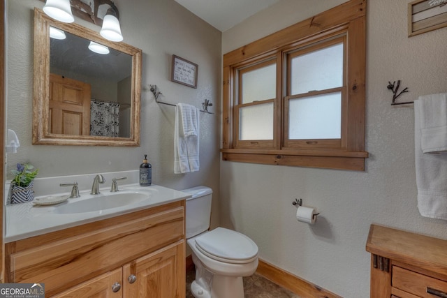 103 Wisteria Dr, Murphy, NC 28906 - bathroom with vanity, toilet, and baseboards