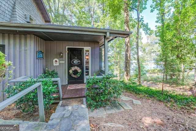 property entrance with board and batten siding