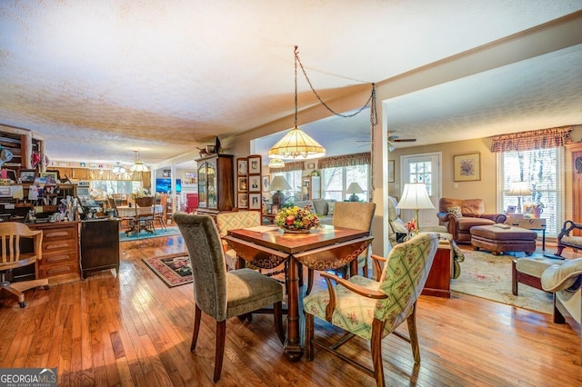 dining area with hardwood / wood-style floors and crown molding