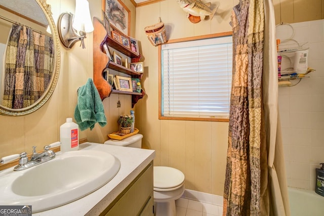 bathroom featuring toilet, tile patterned floors, shower / bath combination with curtain, and vanity