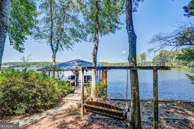 dock area with a water view