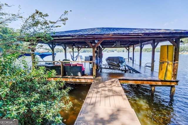 dock area featuring a water view and boat lift