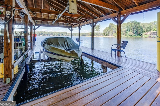 view of dock with a water view and boat lift