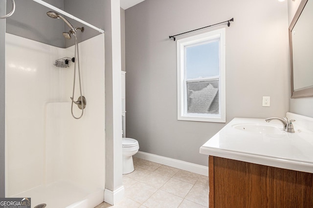 full bathroom with toilet, vanity, baseboards, tile patterned floors, and walk in shower