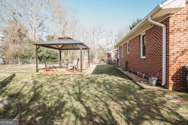 view of yard with a gazebo and fence