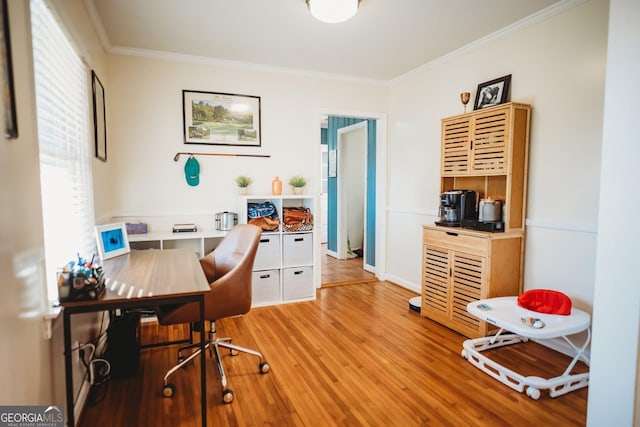 home office featuring crown molding and light wood-style floors