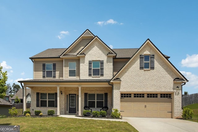 craftsman-style house with a garage, brick siding, fence, concrete driveway, and a front lawn