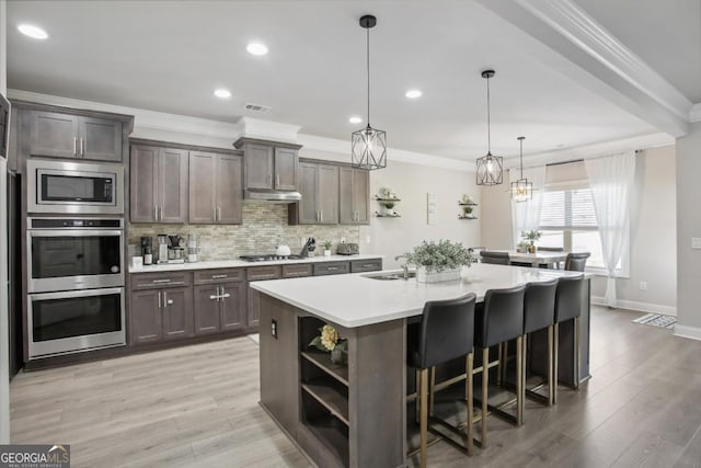 kitchen with open shelves, decorative backsplash, stainless steel appliances, and crown molding