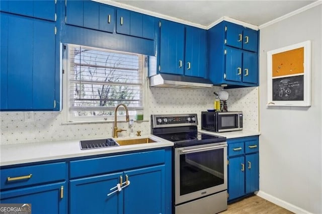 kitchen featuring light countertops, decorative backsplash, stainless steel range with electric cooktop, a sink, and under cabinet range hood