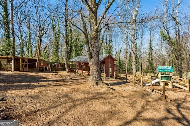 view of yard with an exterior structure and an outdoor structure