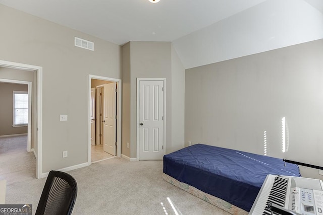 bedroom with lofted ceiling, carpet, visible vents, and baseboards