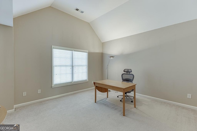 home office featuring light carpet, baseboards, visible vents, and vaulted ceiling