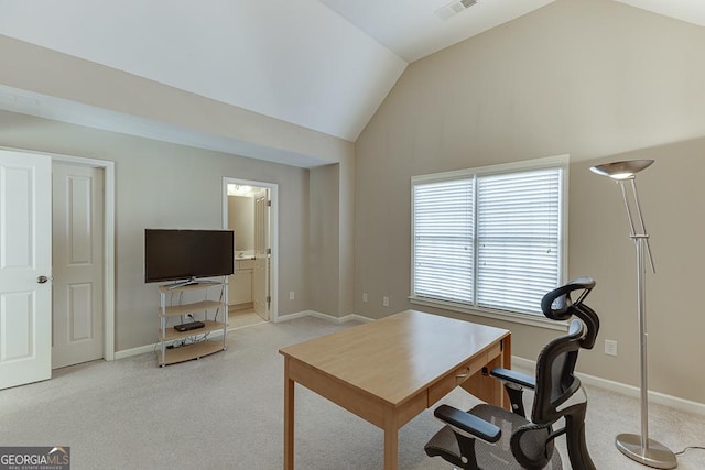 office area featuring baseboards, visible vents, and light colored carpet