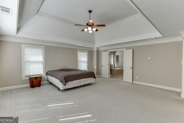 carpeted bedroom with multiple windows, a raised ceiling, visible vents, and crown molding