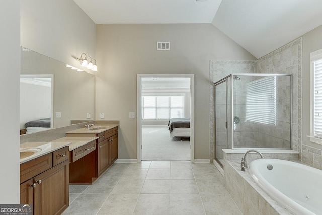 ensuite bathroom with ensuite bathroom, a sink, visible vents, vaulted ceiling, and a shower stall