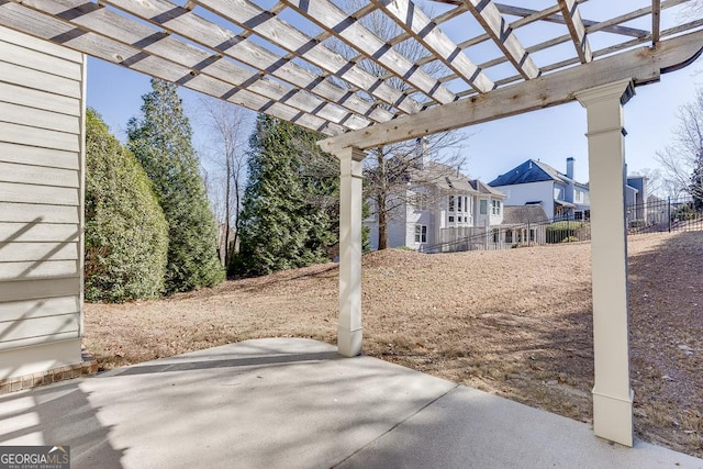 view of patio / terrace featuring fence and a pergola