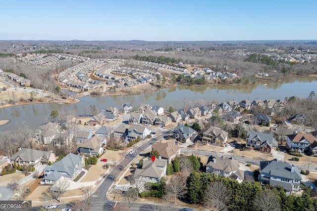 bird's eye view with a water view and a residential view