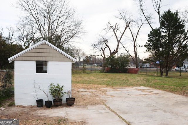 view of outbuilding with an outbuilding and fence