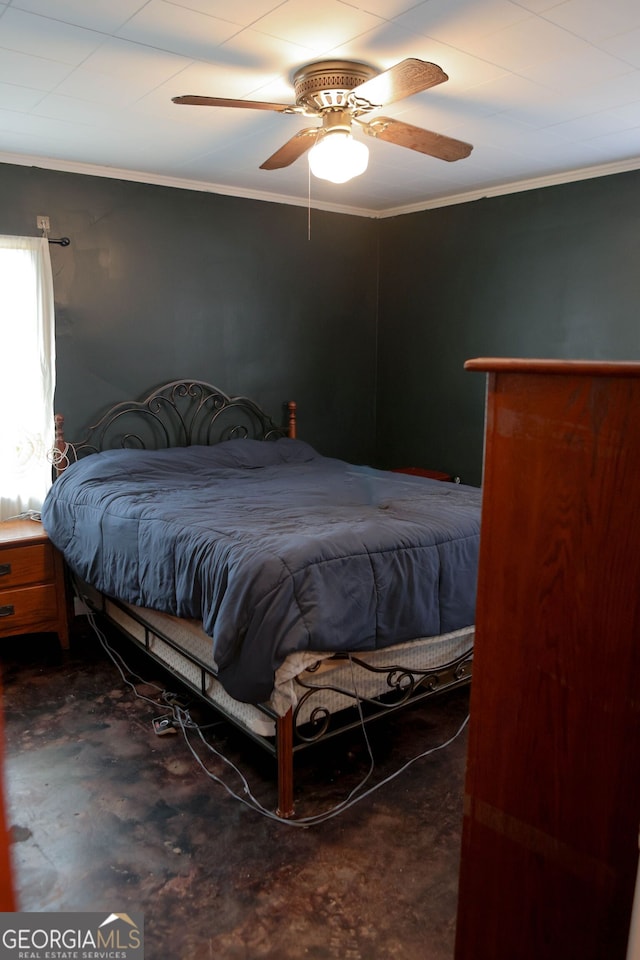 bedroom with ceiling fan and crown molding