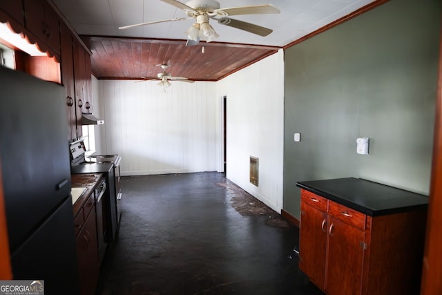 kitchen featuring range with electric cooktop, a ceiling fan, dark countertops, freestanding refrigerator, and concrete flooring