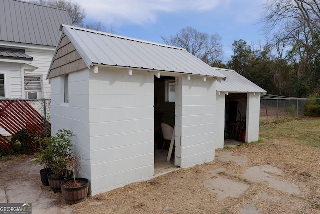 view of shed with fence