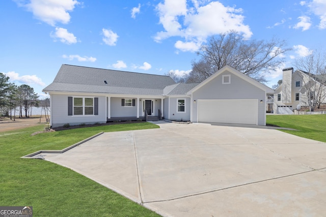 view of front of house featuring an attached garage, a shingled roof, concrete driveway, and a front yard