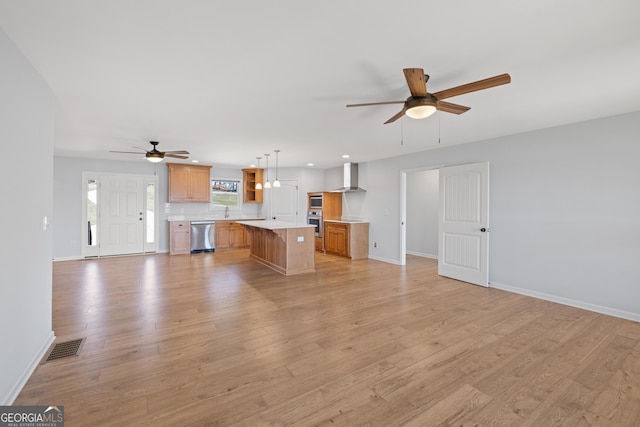 unfurnished living room with ceiling fan, light wood-style flooring, recessed lighting, visible vents, and baseboards