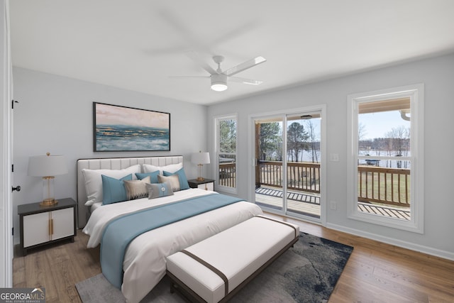 bedroom with access to exterior, ceiling fan, baseboards, and wood finished floors