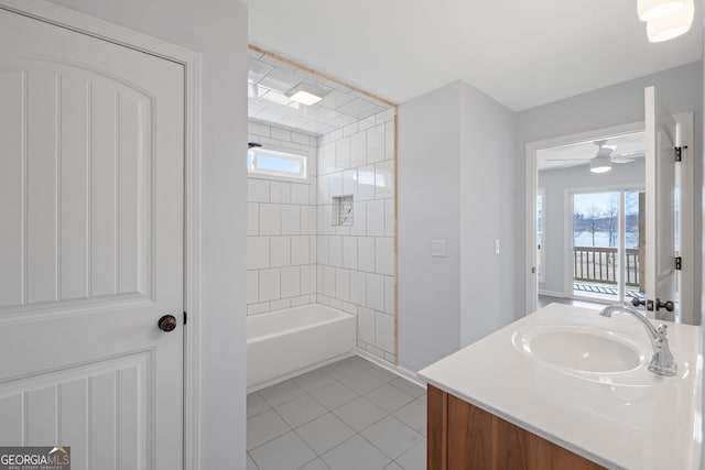 full bathroom with bathtub / shower combination, vanity, and tile patterned floors