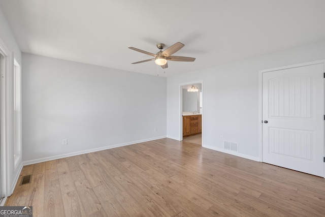 unfurnished bedroom with light wood-style floors, baseboards, and visible vents