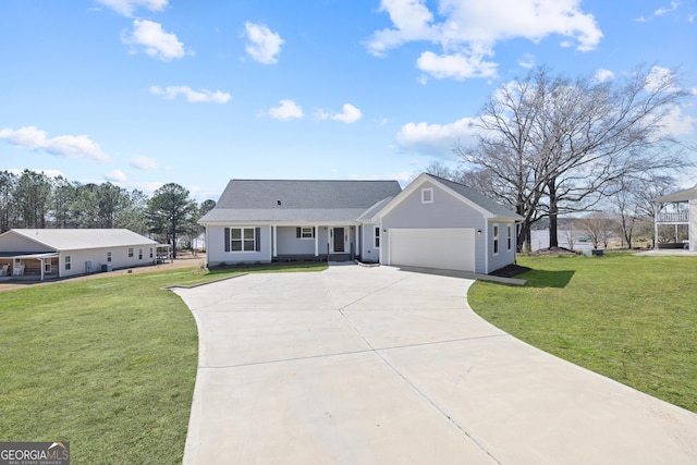 ranch-style home featuring a garage, driveway, and a front lawn