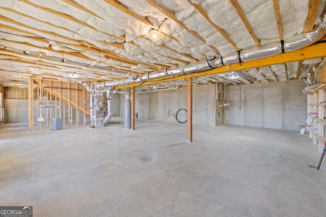 unfinished basement featuring heating unit