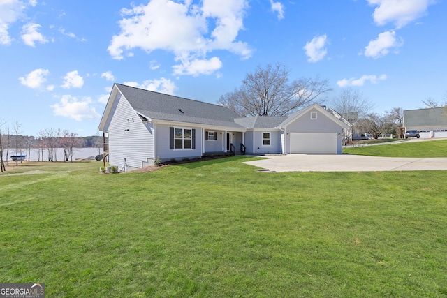 view of front facade featuring a garage, driveway, and a front lawn