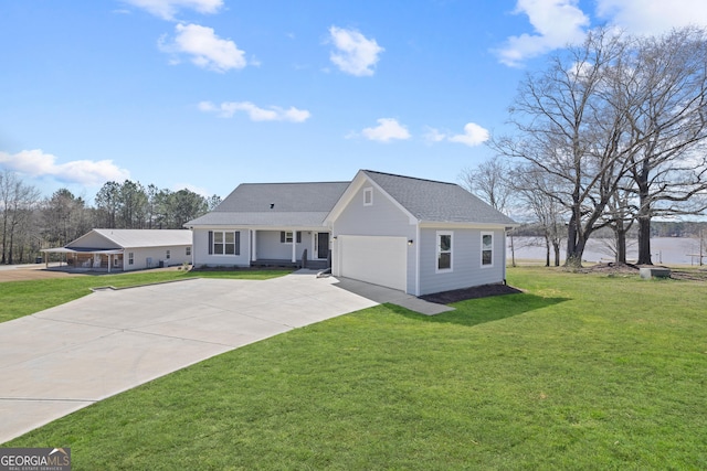 view of front of house with a shingled roof, concrete driveway, an attached garage, and a front lawn