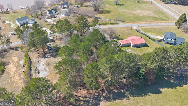 birds eye view of property with a rural view