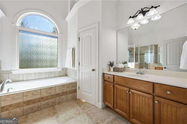 bathroom featuring a stall shower, tile patterned flooring, vanity, and a bath