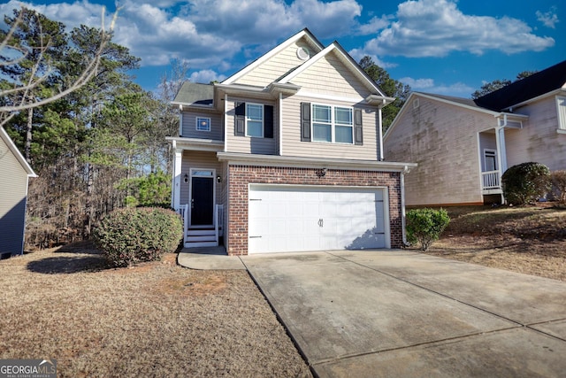 view of front of home featuring an attached garage, concrete driveway, and brick siding