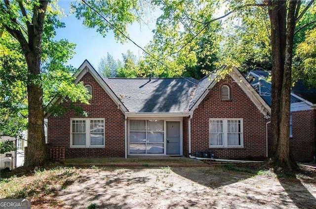 view of front of house featuring brick siding