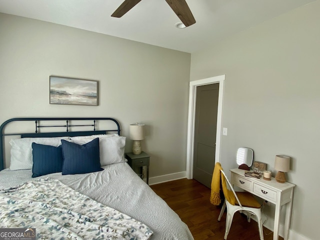 bedroom with a ceiling fan, baseboards, and wood finished floors