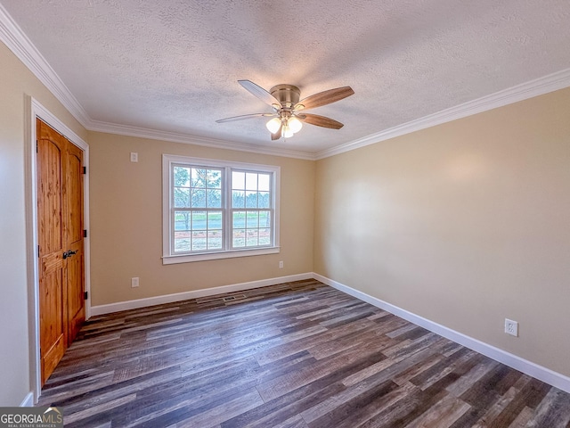 unfurnished room featuring ceiling fan, a textured ceiling, baseboards, ornamental molding, and dark wood finished floors