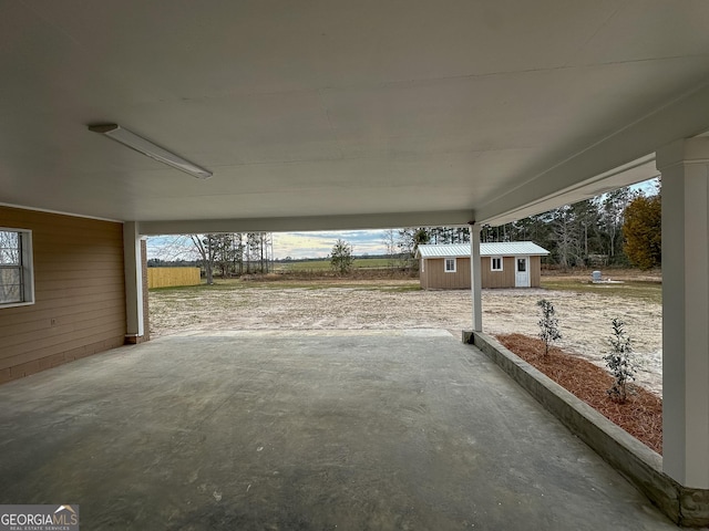 view of patio featuring an outbuilding